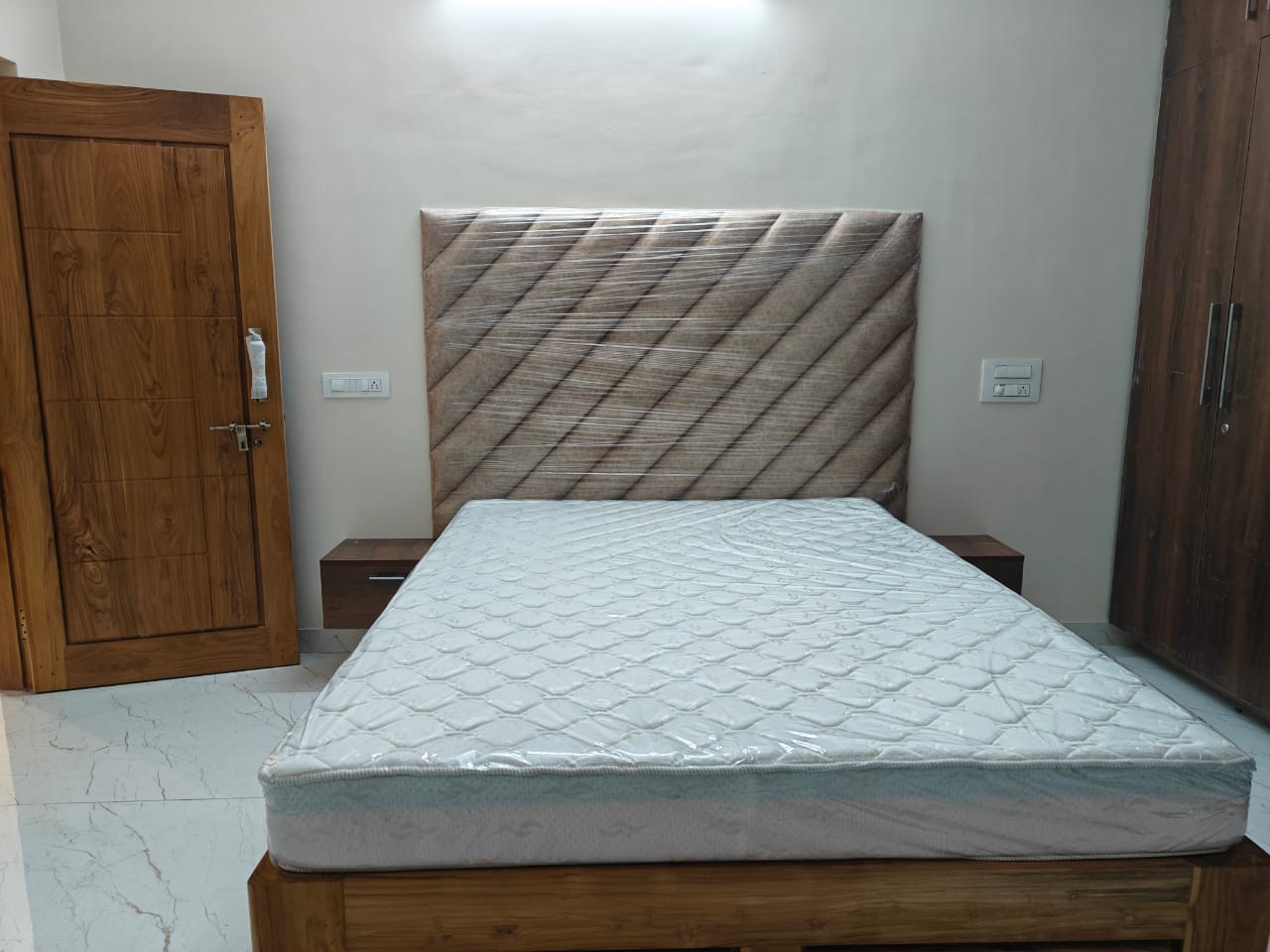 Bed and mattress in a finished bedroom